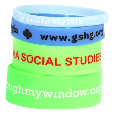 Glow In The Dark Wristbands Customized with Options Including; Emboss,  Deboss, and Screen Printing on a Color Silicone Band