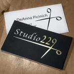 Luxurious metallic gold foil highlights elegantly stamped on premium black uncoated card stock, capturing a sophisticated matte finish