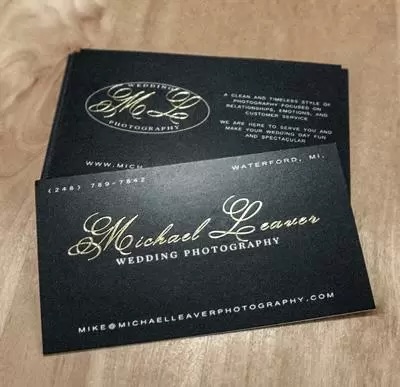 Elegant uncoated business card with gold foil stamped logo on natural matte stock