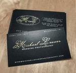 Elegant uncoated business card with gold foil stamped logo on natural matte stock